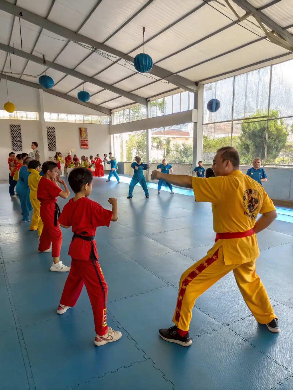 A diverse group of karate students participating in a special karate workshop or seminar at Bunkai Karate Do.